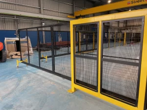 Telescopic sliding door in black and yellow machine guarding