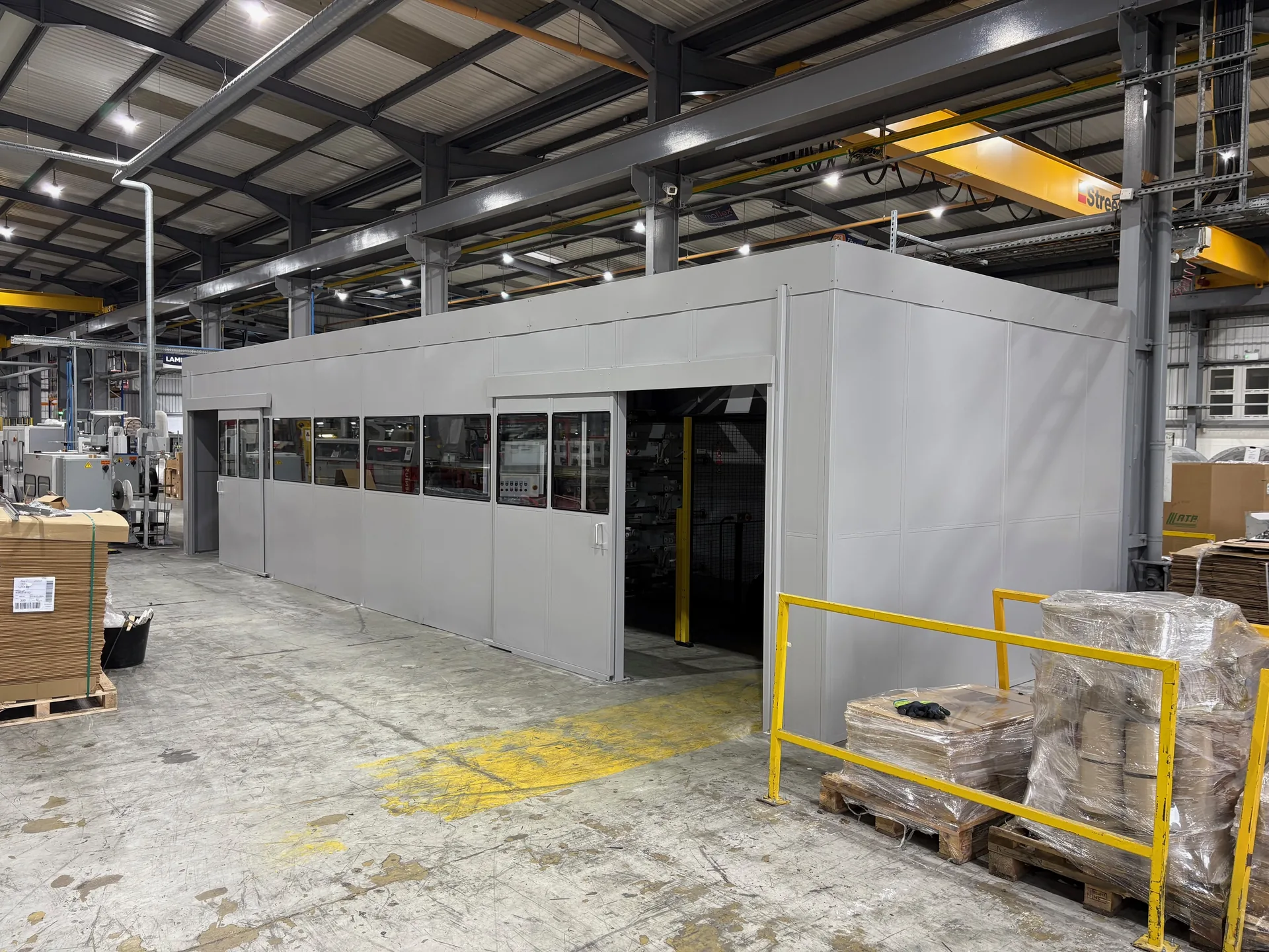 Single skin steel machine room with a glazed front and sliding doors in Wigan