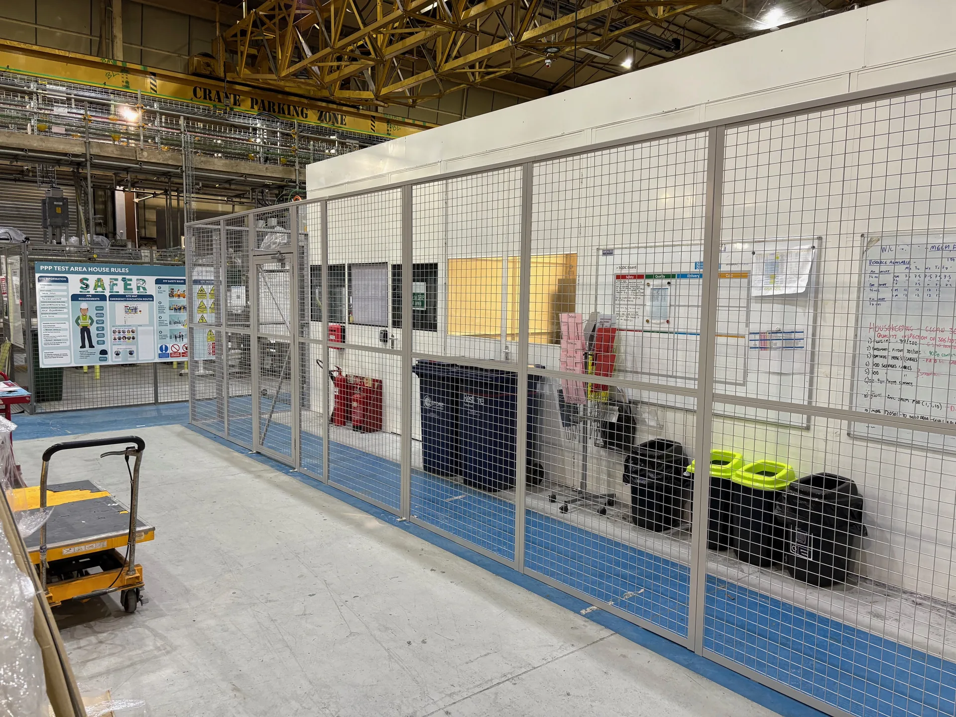 Mesh walkway partitioning running alongside a factory office in West Bromwich